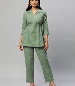 A statement dobby fabric co-ord set with collar and belt.