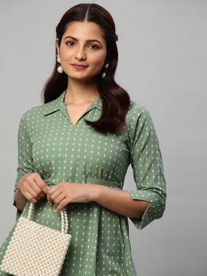 A statement dobby fabric co-ord set with collar and belt. 3