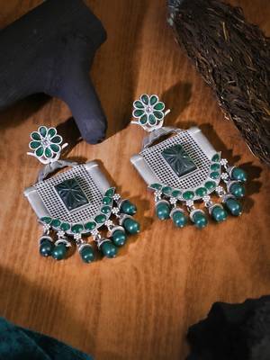 Oxidised green stone-studded pearl-tessels earrings 1