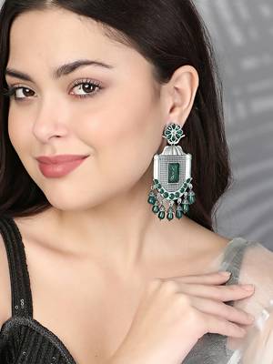 Oxidised green stone-studded pearl-tessels earrings 2