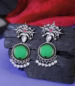 Oxidised green stone-studded pearl-tessels earrings