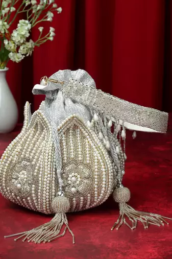 lotus silver & off white floral embellished faux silk potli