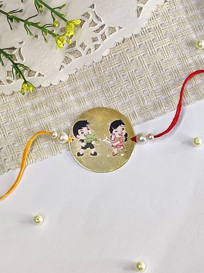 The Magic Wand Trendy Brother Sister Printed Golden Rakhi With Pearls Embelishment-Golden