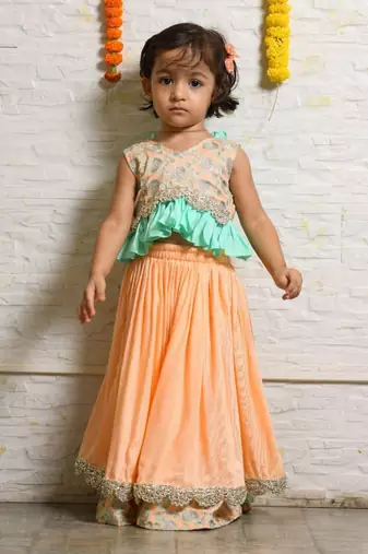 Peach and aqua green heavy embroidered ghagara set