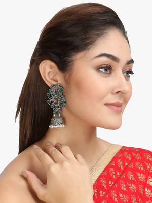 Women silver plated green stone-studded peacock shaped jhumka 1