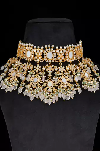 White gold finish kundan and mother of pearls necklace set