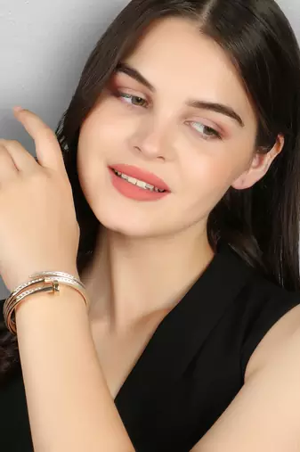 Women gold plated stone studded layered bracelet