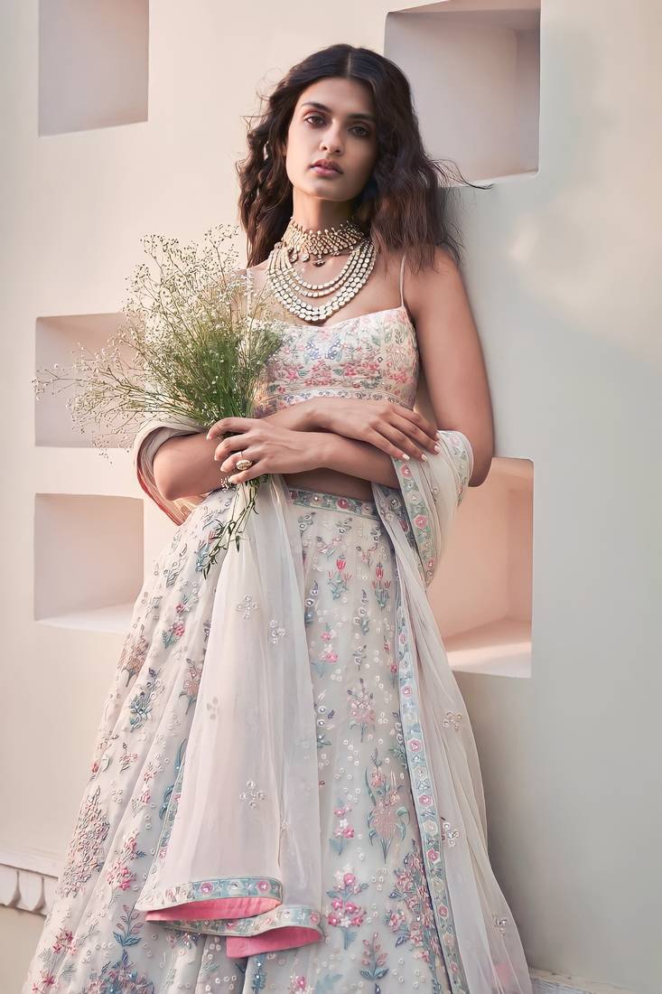 Cream Georgette Thread Embroidered Sleeveless Lehenga Choli With Net Dupatta