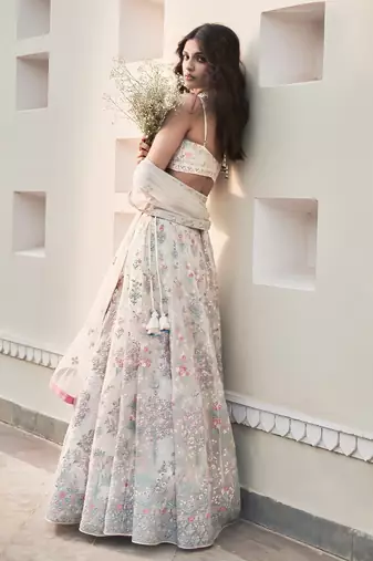 Cream Georgette Thread Embroidered Sleeveless Lehenga Choli With Net Dupatta