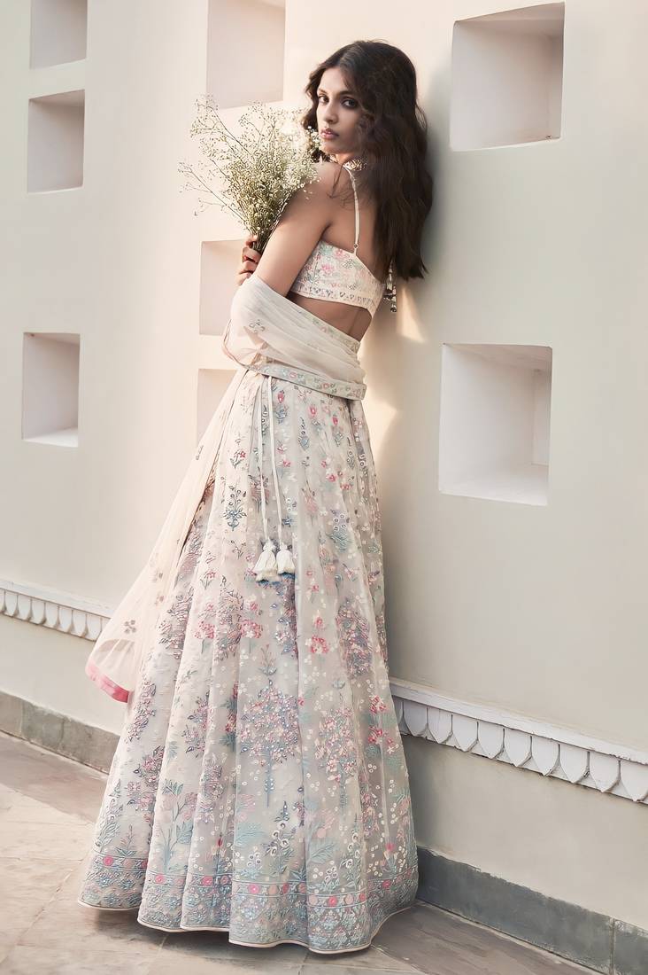 Cream Georgette Thread Embroidered Sleeveless Lehenga Choli With Net Dupatta