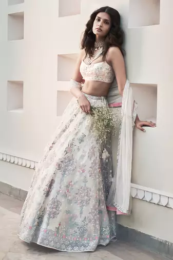 Cream Georgette Thread Embroidered Sleeveless Lehenga Choli With Net Dupatta