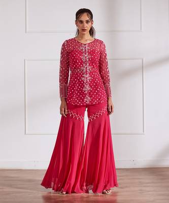 Fuscia net peplum with bustier and gharara 1