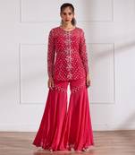 Fuscia net peplum with bustier and gharara