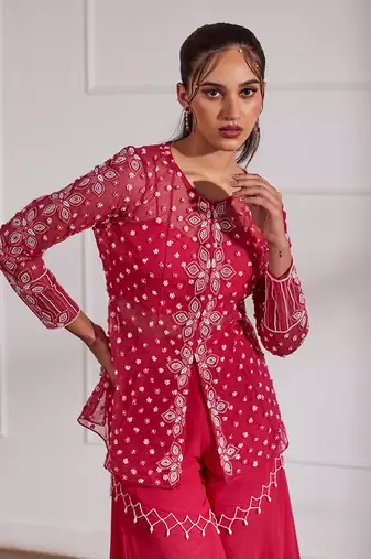 Fuscia net peplum with bustier and gharara
