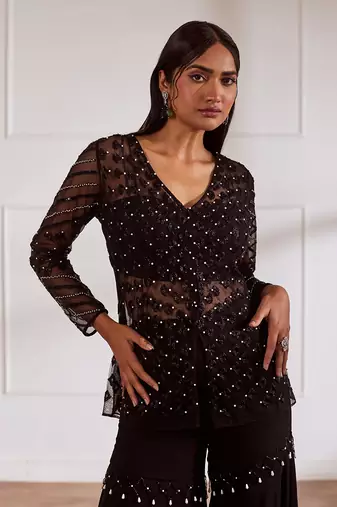 Black net peplum with bustier and gharara