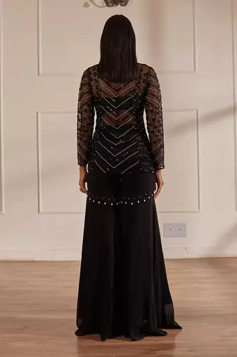 Black net peplum with bustier and gharara