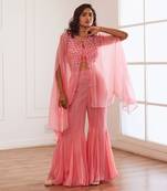 Peachish pink croptop and sharara and cape.