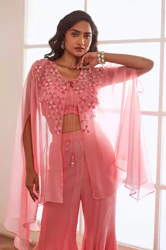 Peachish pink croptop and sharara and cape.