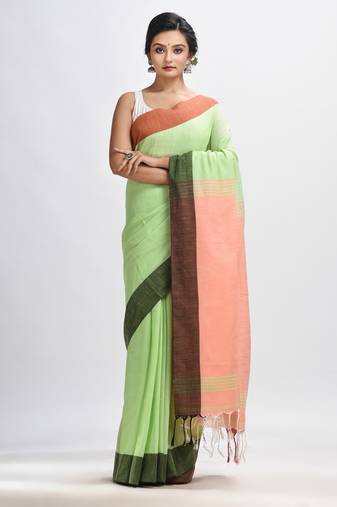 Light green cotton with solid body in tawny peach pallu handloom saree