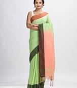 Light green cotton with solid body in tawny peach pallu handloom saree