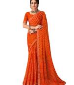 Orange printed chiffon bandhani saree with blouse