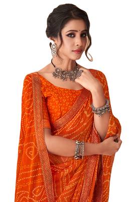 Orange printed chiffon bandhani saree with blouse 2