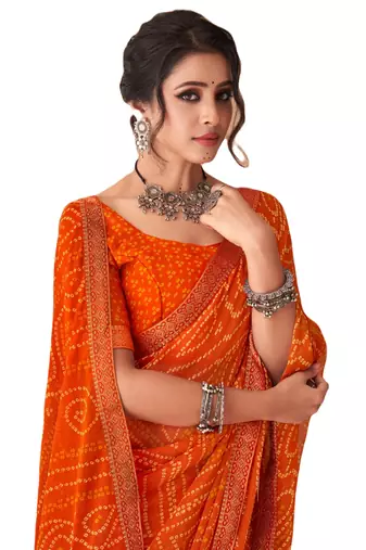 Orange printed chiffon bandhani saree with blouse