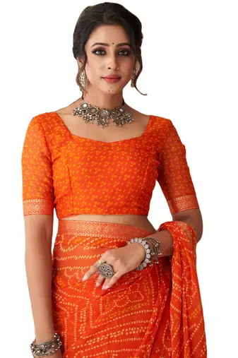 Orange printed chiffon bandhani saree with blouse