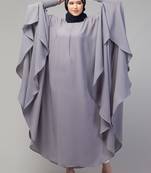 Nazneen smoking at sleeve Irani kaftan