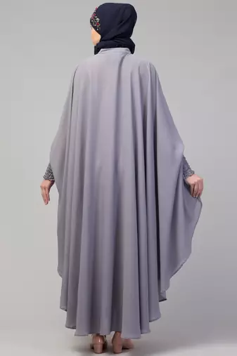 Nazneen smoking at sleeve Irani kaftan