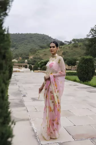   White pink shaded hand painted floral chiffon saree with blouse