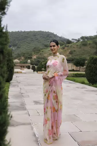   White pink shaded hand painted floral chiffon saree with blouse