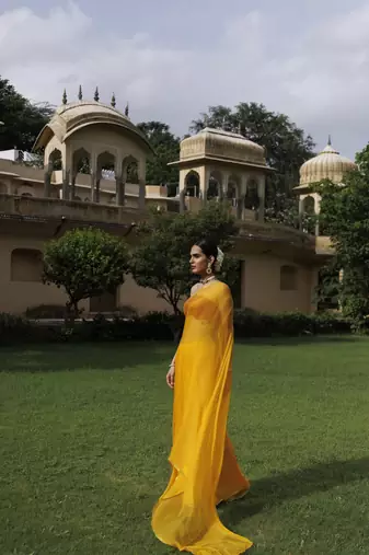   Yellow hand dyed plain chiffon saree with jacquard blouse