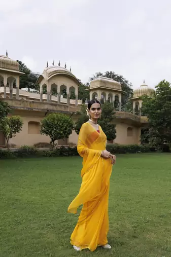   Yellow hand dyed plain chiffon saree with jacquard blouse