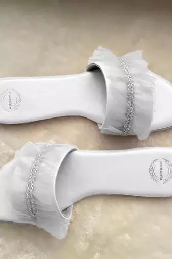 White ruffle flats