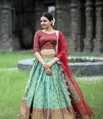 GREEN KANJIVARAM SILK ZERI WEAVING LEHENGA CHOLI