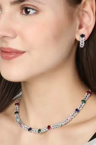 Rodium-plated stone -studded necklace & earring set