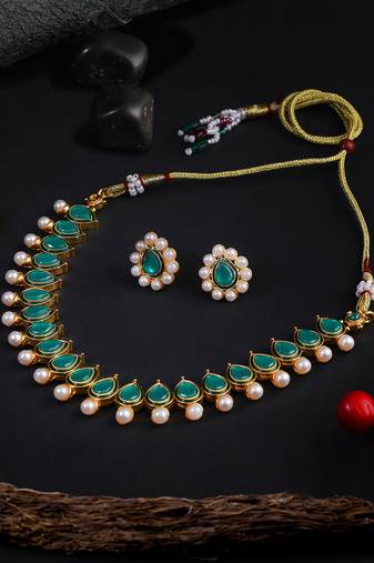 Women gold-plated green stone-studded pearl beaded jewellery set