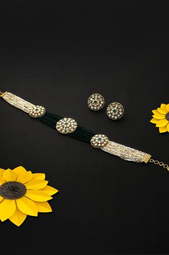 Gold-plated green  white stone-studded beaded handcrafted jewellery set