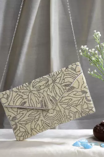 ghoomar beige & off white abstract embellished canvas sling bag