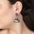 Oxidised pink stone-studded pearl-tessels jhumkis