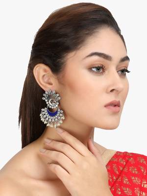 Women silver plated green stone-studded peacock shaped earing 1