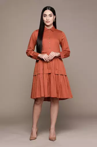 Rust shirt dress with ruffled hem