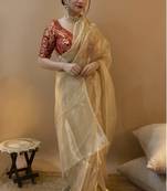 Golden Elegance: Organza Gold Saree with Maroon Jacquard Blouse - A Luxurious Fusion for Festive Glam