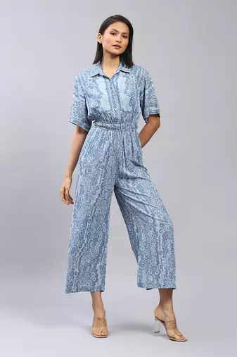 Blue floral print denim jumpsuit by LABEL