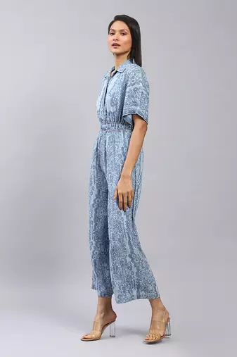 Blue floral print denim jumpsuit by LABEL