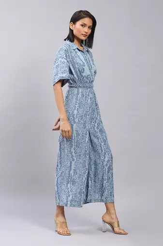 Blue floral print denim jumpsuit by LABEL