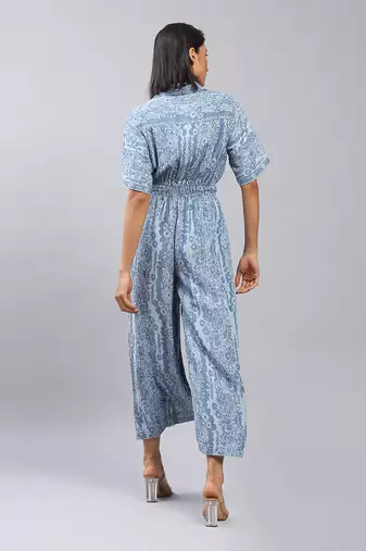 Blue floral print denim jumpsuit by LABEL