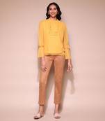 Mustard ruffle top by LABEL