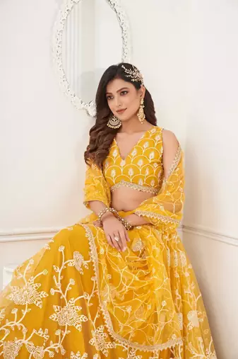 Ethnic And Net Fabric Mustard Yellow Colour Partywear Lehenga